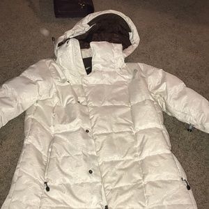 A white North Face winter puff jacket
